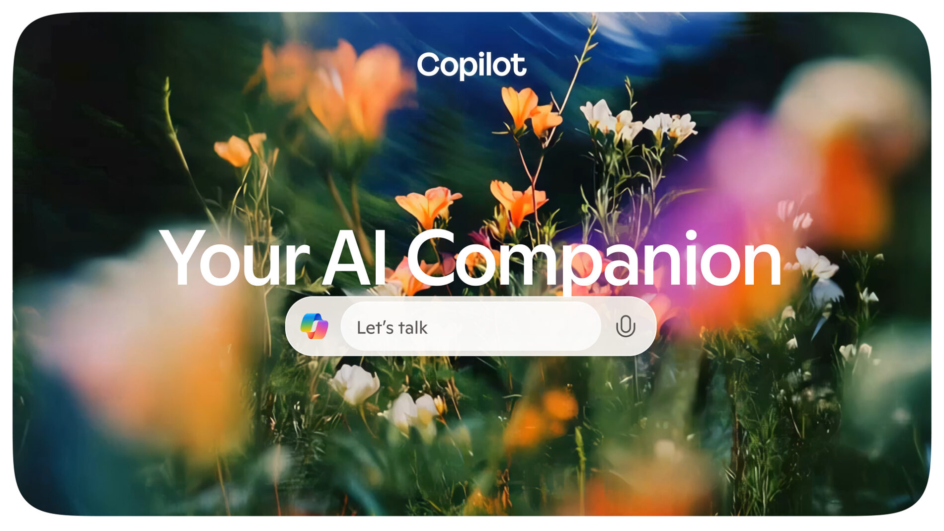 Fondo de pantalla con flores sobre el que aparece la caja de texto de Copilot y el rótulo Your AI Companion